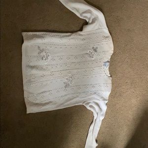 A long sleeve white sweater